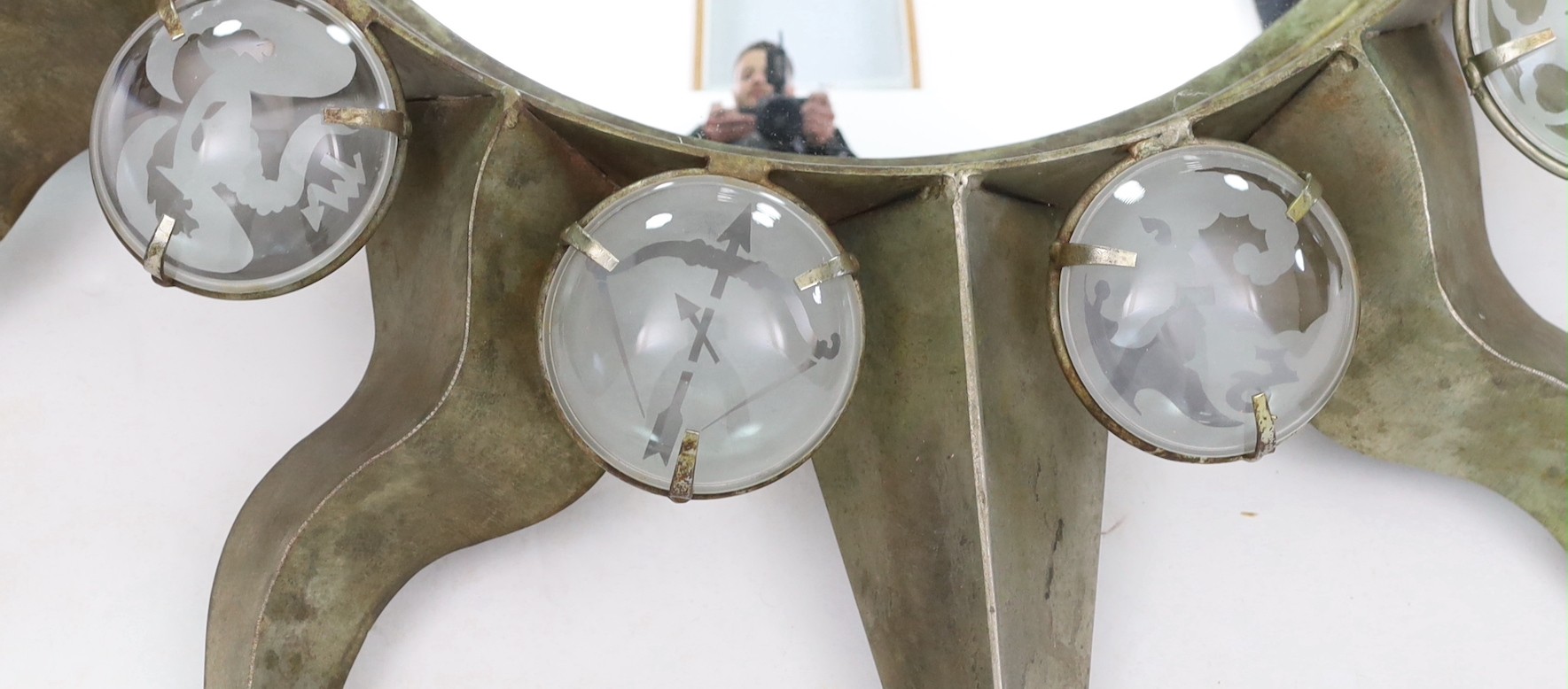 Mark Brazier Jones (b.1956) 'Zodiac' mirror, circa 1990, copper plated steel with etched glass cabochons, diameter 100cm